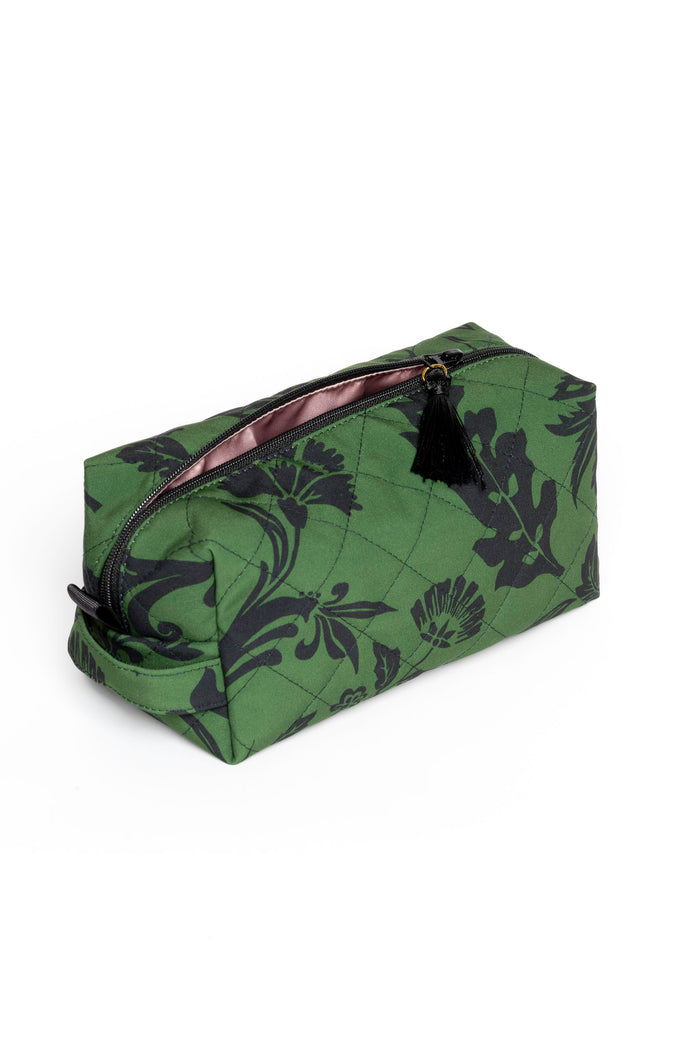 Small green floral makeup pouch with black floral print, tassel zipper pull, and violet satin lining.