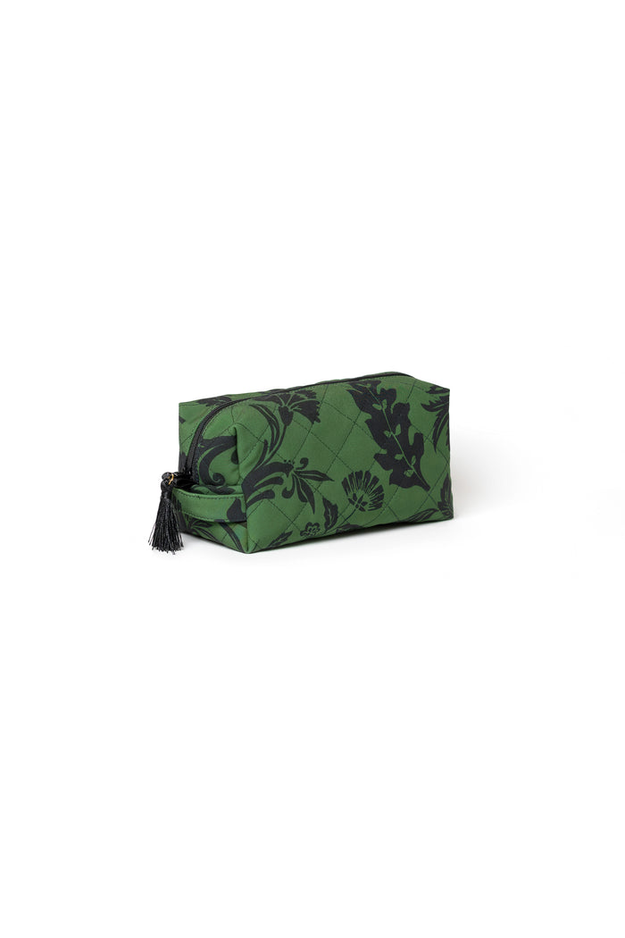 Premium women's cosmetic bag in green with black floral print, decorative tassels, and soft violet lining.