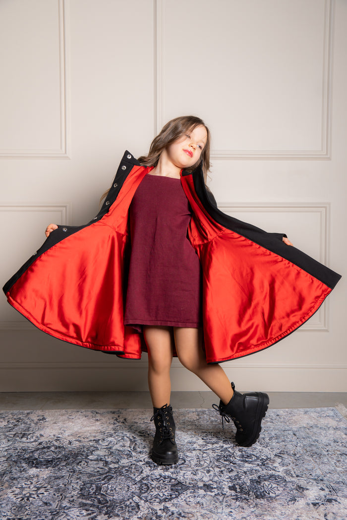 opened coat with bright red lining