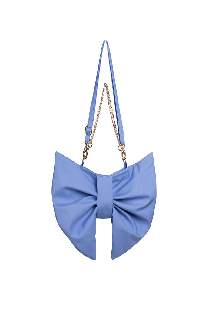Soft blue bow-shaped handbag with a chain strap on a white background