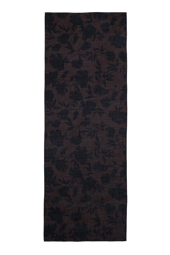 A brown floral scarf featuring a subtle tonal floral pattern, shown against a plain white background.