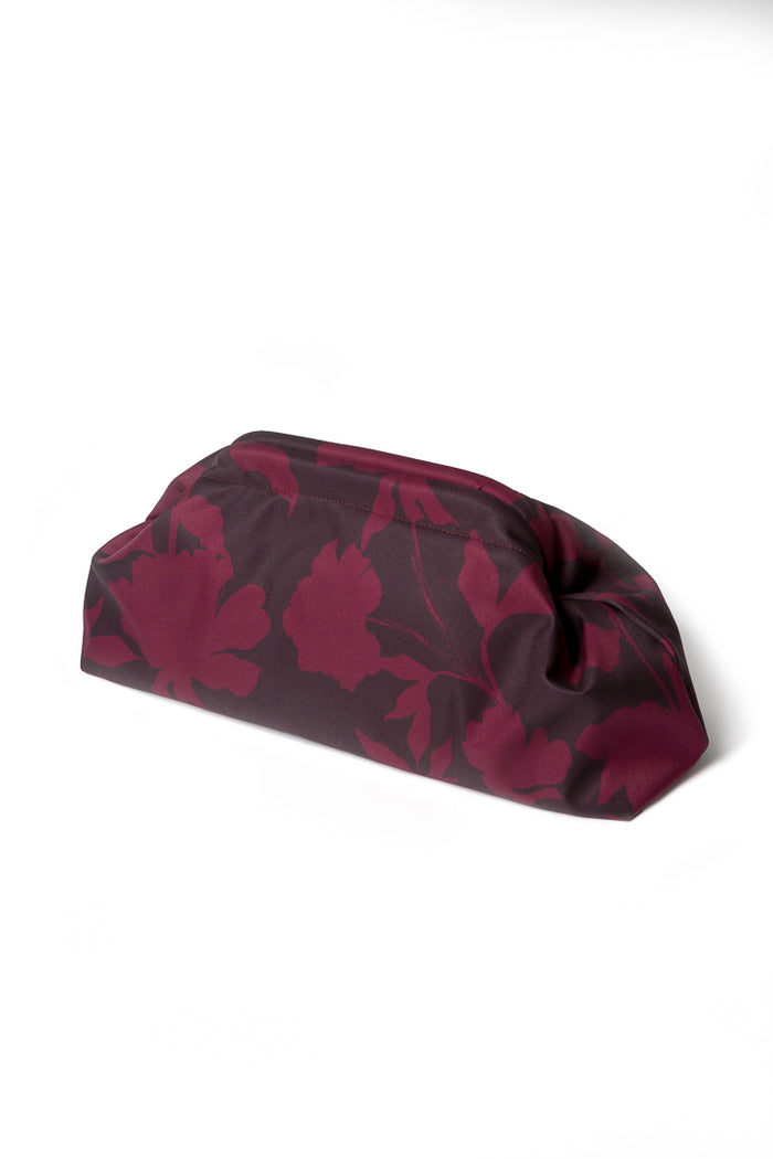 Burgundy floral clutch bag showcasing the rich wine-toned floral print, vintage-inspired frame closure, and beautifully structured design.