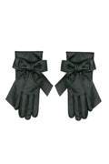 A pair of deep green leather gloves with wide cuffs and large bow details, displayed flat against a white background.