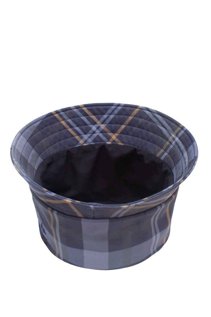 Women’s blue softshell hat with classic plaid pattern, designed to pair with matching blue coats.