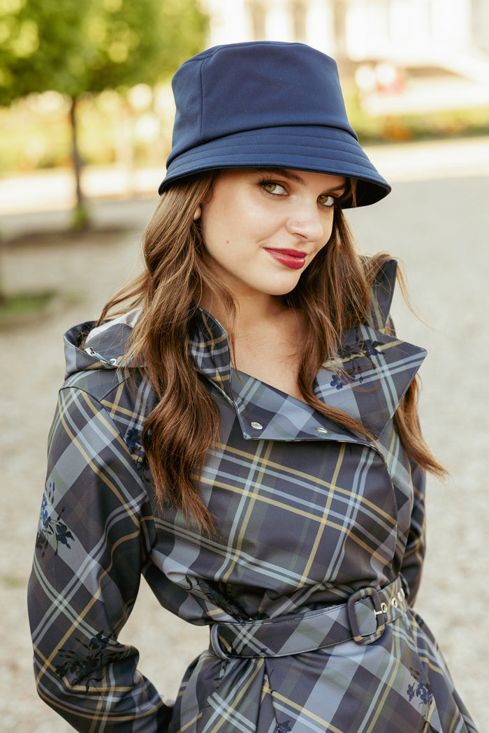 Stylish women’s waterproof bucket hat in deep blue.