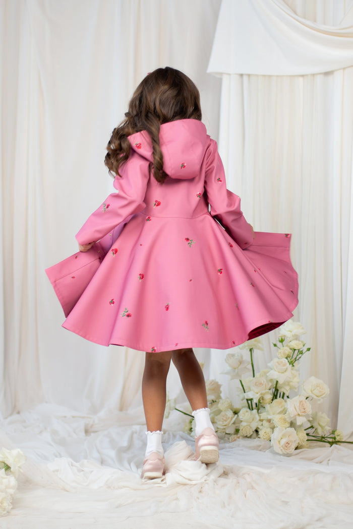 Back view of the pink girls' coat showcasing its flattering fit