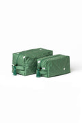 Green floral cosmetic bag set with white floral print, mint lining, green zippers, and decorative tassels.