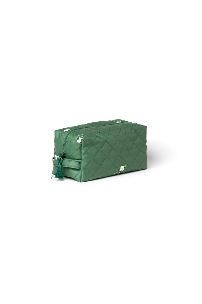 Large green floral toiletry bags with zip closures, mint lining, and decorative tassel details.