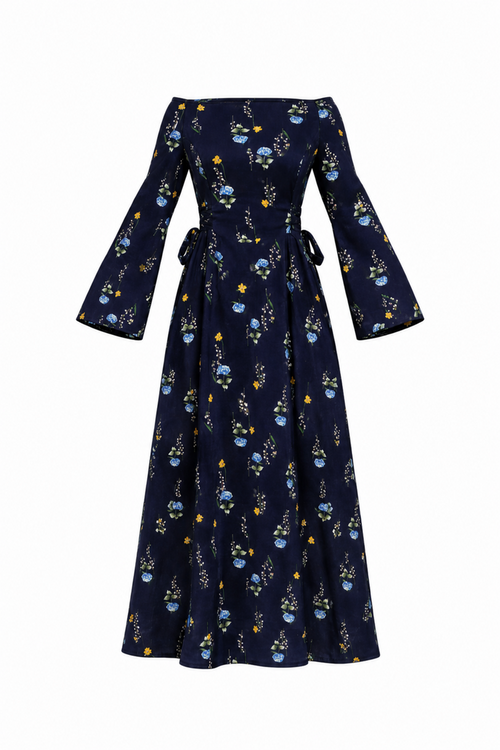A navy blue off-the-shoulder maxi dress with long bell sleeves, featuring a delicate blue and yellow floral pattern and a tie waist, shown against a plain white background.