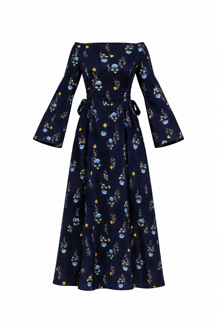 A navy blue off-the-shoulder maxi dress with long bell sleeves, featuring a delicate blue and yellow floral pattern and a tie waist, shown against a plain white background.
