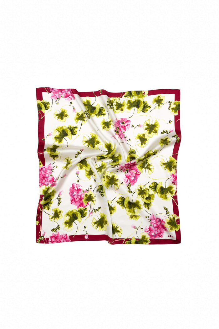Floral patterned fabric square on a white background
