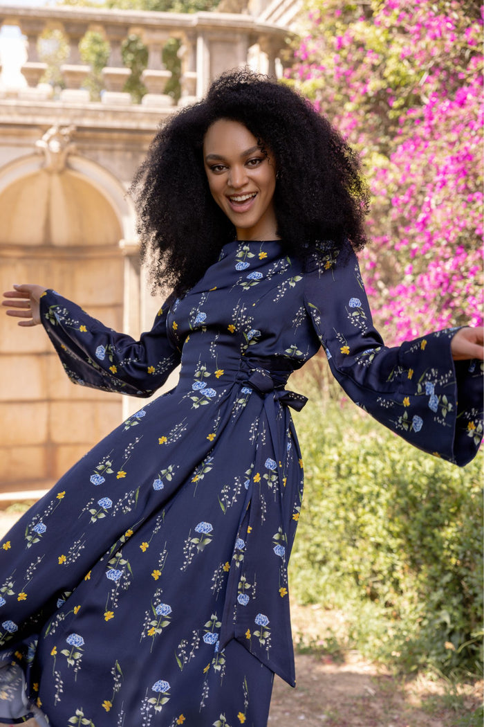 Elegant Meadow Dream midi dress with long flared sleeves, open shoulders, and adjustable waist for a flattering fit