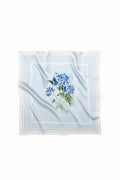 Light blue natural silk scarf with flower print on it.