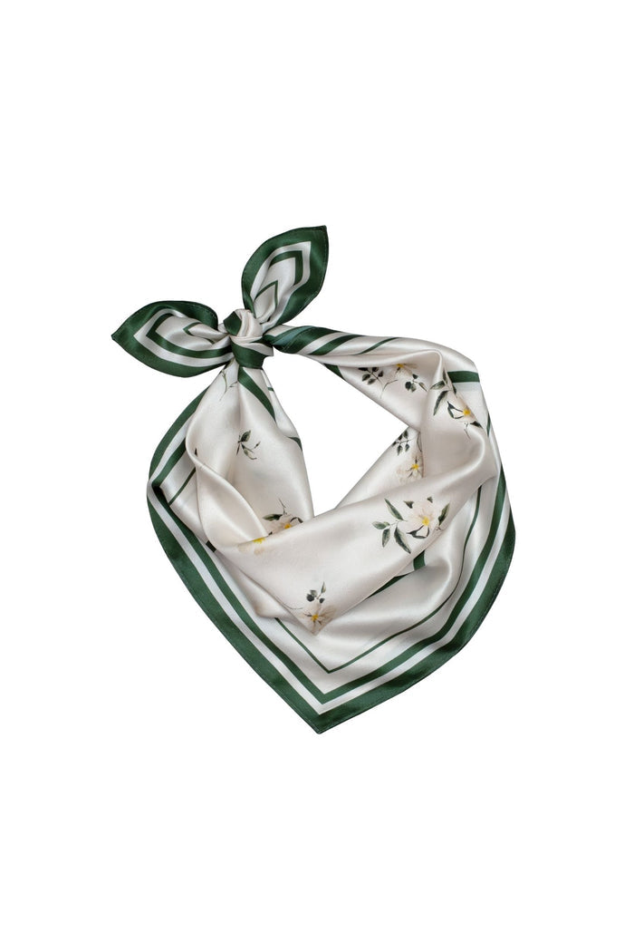 Green and white patterned scarf on a white background
